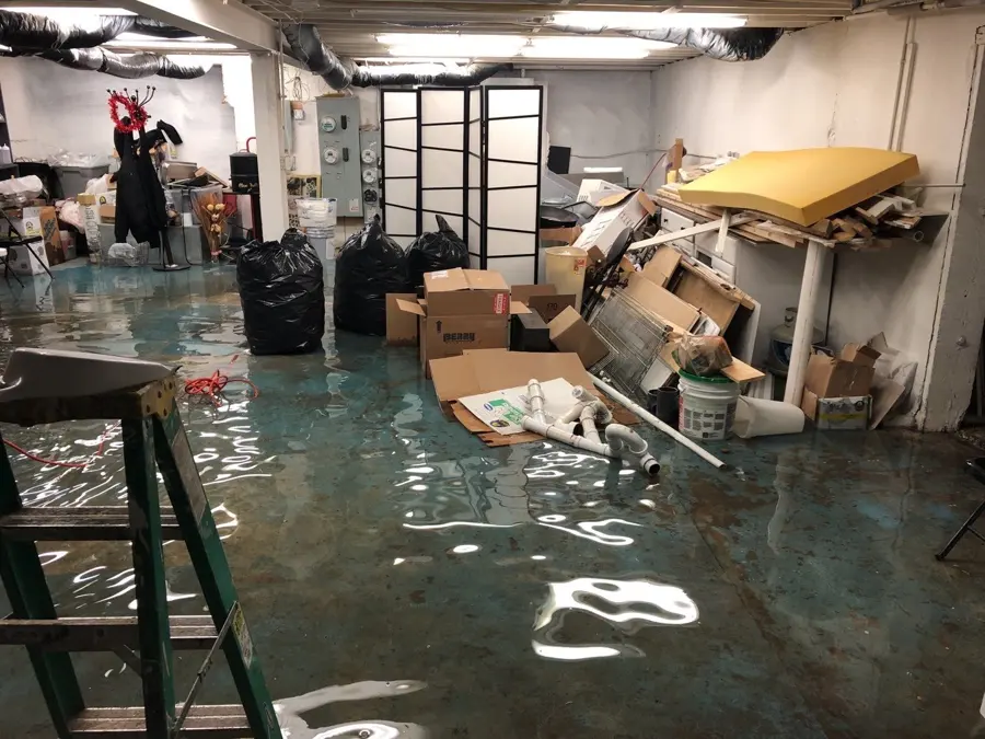 Flooded lower level being cleaned in a Palmetto, GA home